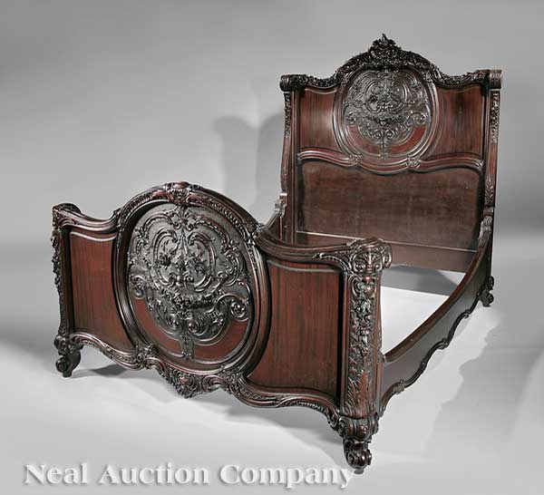 An Antique Carved Mahogany Four-Piece Bedroom