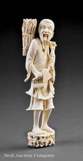 A Chinese Ivory Figure of a Fisherman
