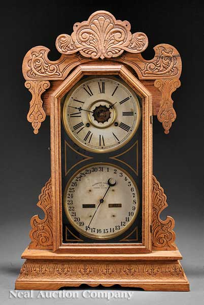 An Antique American Carved Oak Calendar Clock