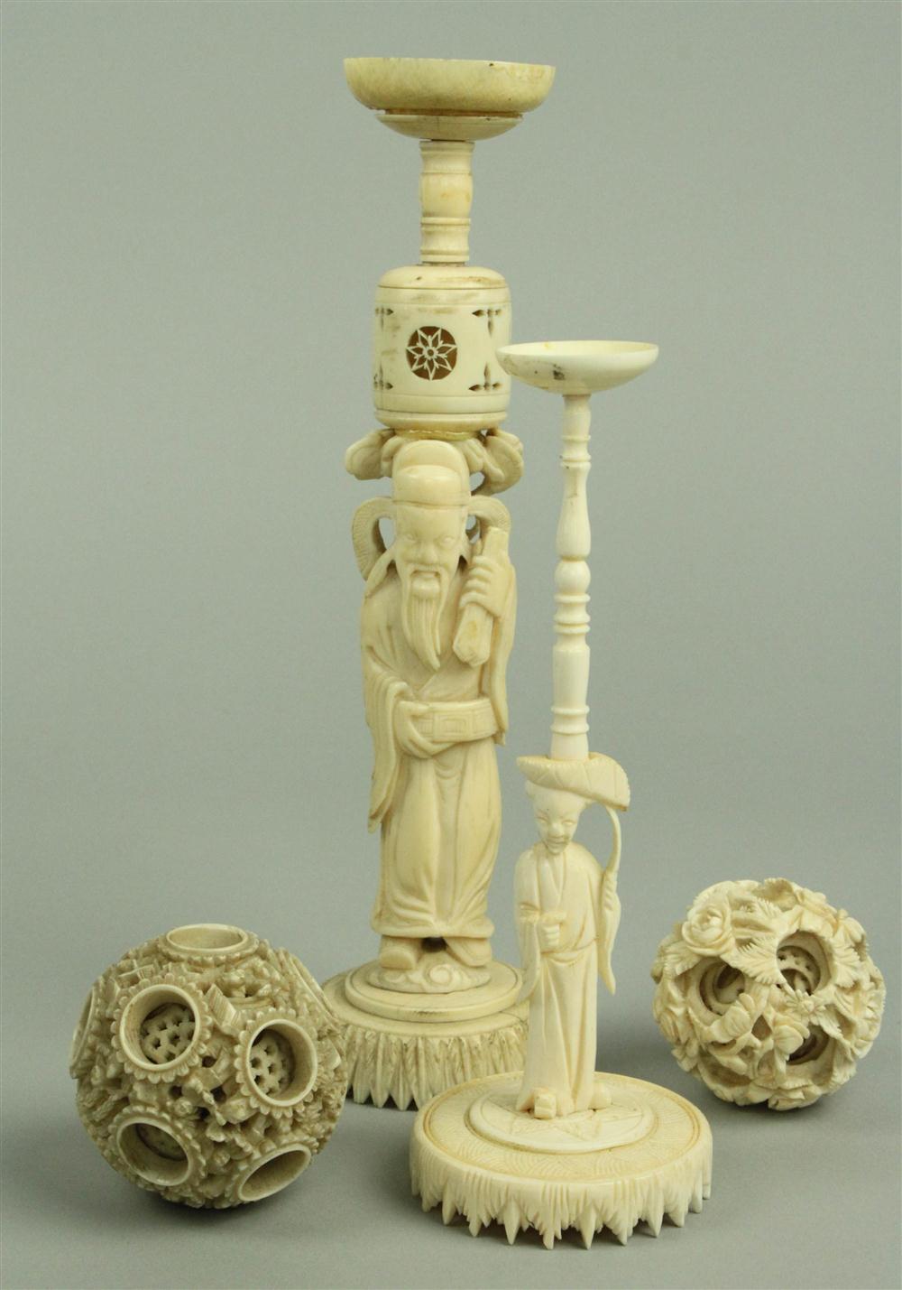 TWO SMALL CHINESE IVORY PUZZLE BALLS ON FIGURAL