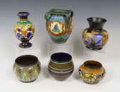 SIX GOUDA POTTERY VASES AND JARDINIERE: