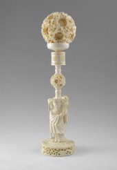 LARGE CARVED IVORY MYSTERY BALL ON FIGURAL