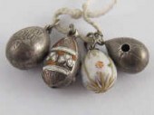 Four Russian silver egg pendants two