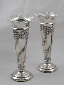 A pair of embossed silver spill 14deff