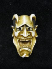 Carved Ivory Netsuke of a Devils Face