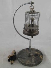 A hanging birdcage clock (AF) circa