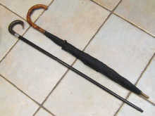 An ebonised mahogany walking stick 14e98c