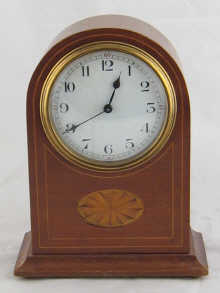 A mahogany cased mantel clock with 14f04c