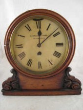 An oak boardroom bracket clock circa