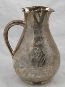 A Victorian silver water jug with 14f571