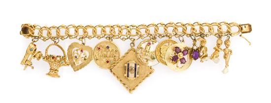 A 14 Karat Yellow Gold Charm Bracelet 1537cf