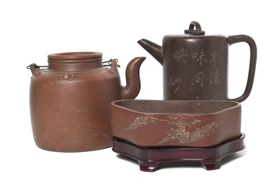 * A Group of Yixing Pottery Teapots comprising