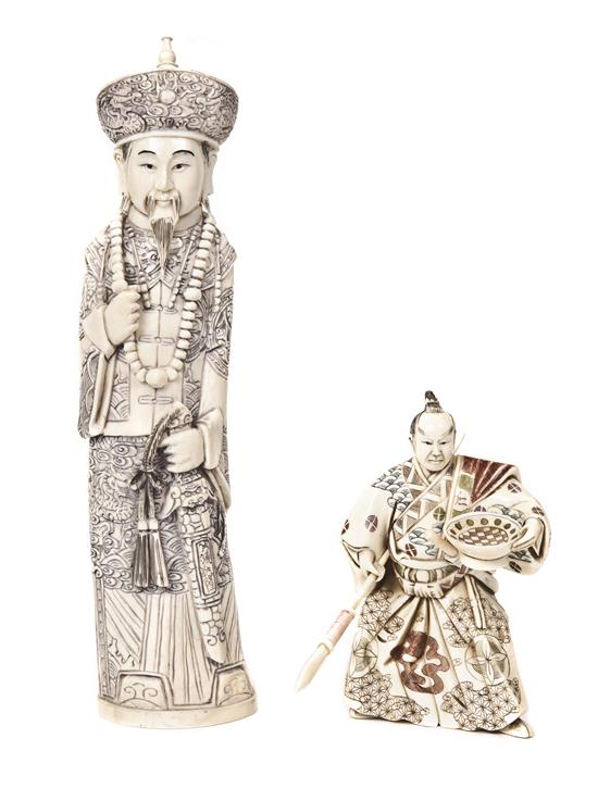 A Chinese Carved Ivory Figure of a Man together