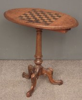 A Victorian walnut oval games table 15cf59