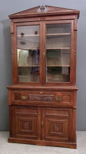 A late Victorian carved walnut Secretaire