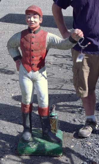 Price guide for Cement lawn jockey.