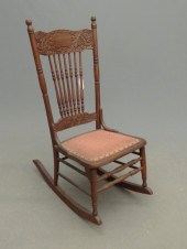 Victorian pressed back oak rocking chair.