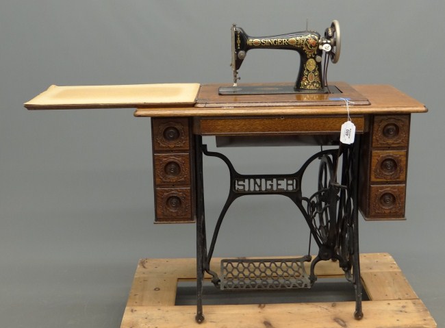 C. 1900's oak case Singer sewing machine.