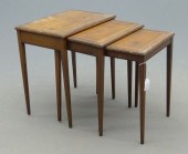 Nest of three leather top tables. Leather