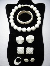 Carved ivory jewelry nine pieces including: