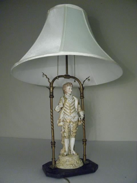 Bisque porcelain figural table lamp with