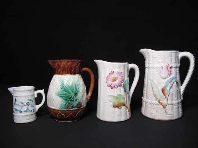 Four Majolica pottery pitchers  16babc