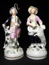Pair of Staffordshire porcelaneous figures.