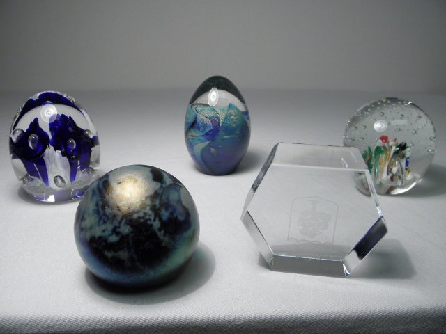 Lot of five assorted art glass paperweights.