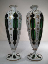 A pair of Bohemian green glass vases