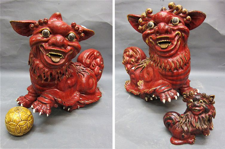 A PAIR OF CHINESE GUARDIAN LIONS of red oxblood