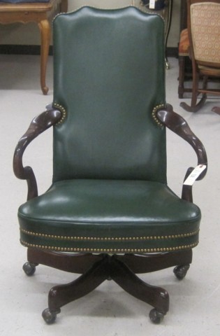 A MAHOGANY AND GREEN LEATHER SWIVEL DESK