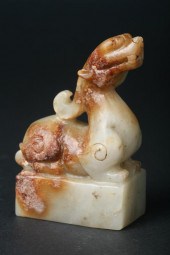 CHINESE CELADON AND RUSSET JADE QILIN