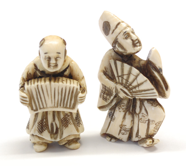 TWO IVORY CARVED NETSUKE man in 170605