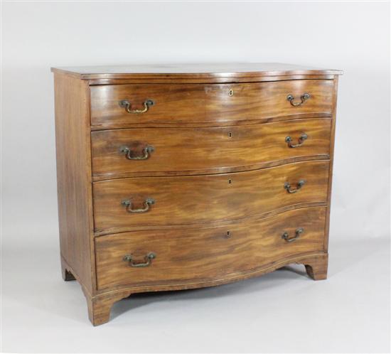 A George III mahogany serpentine chest of