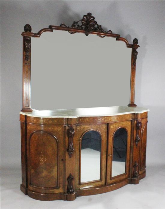 A Victorian carved and inlaid walnut serpentine