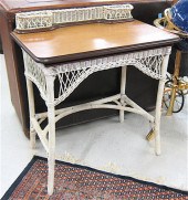 AN OAK AND WHITE WICKER WRITING TABLE