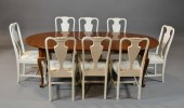 A CHIPPENDALE STYLE DINING SET WITH