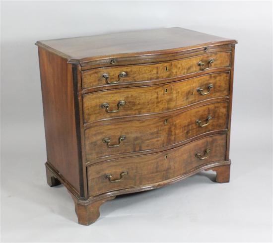 A George III mahogany serpentine chest with