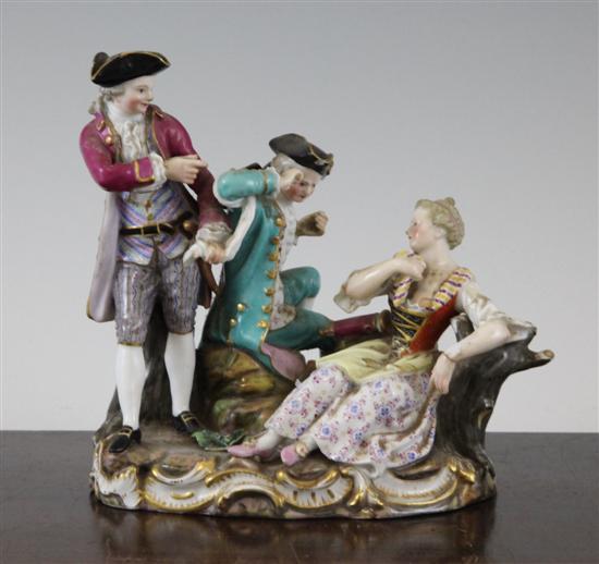 A Meissen group of two gentleman and a lady
