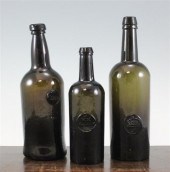 An English black glass sealed wine bottle