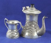 An Indian white metal coffee pot and