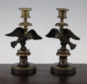 A pair of Regency bronze candlesticks