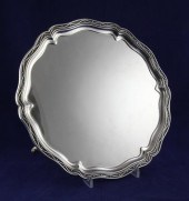 A George V silver salver of shaped circular