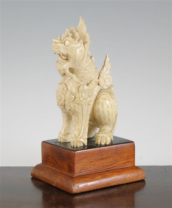 A Burmese ivory figure of a seated Buddhist