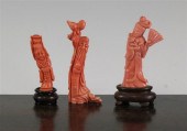 Three Chinese coral figures carved as