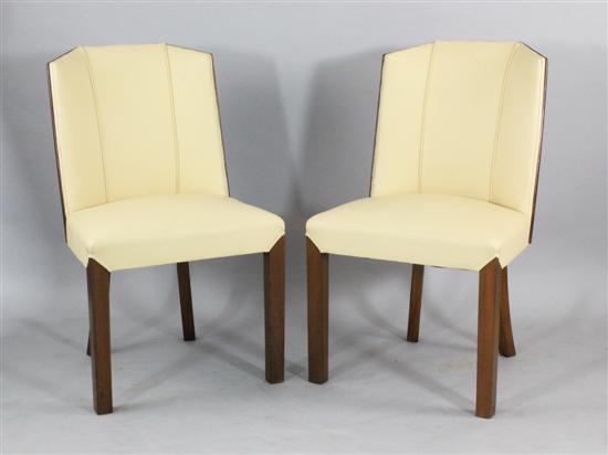 A set of eight Art Deco walnut dining chairs