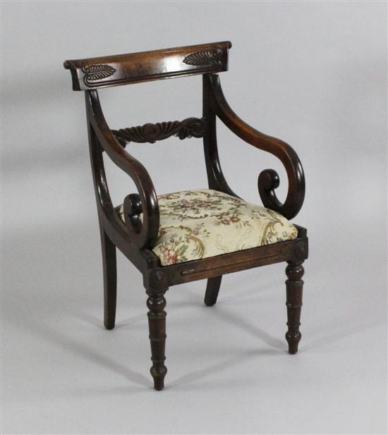 A Regency carved beech child's armchair on