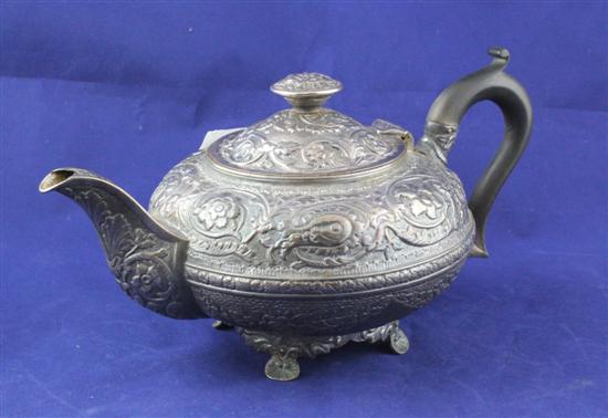 A George III embossed silver teapot 1719b0