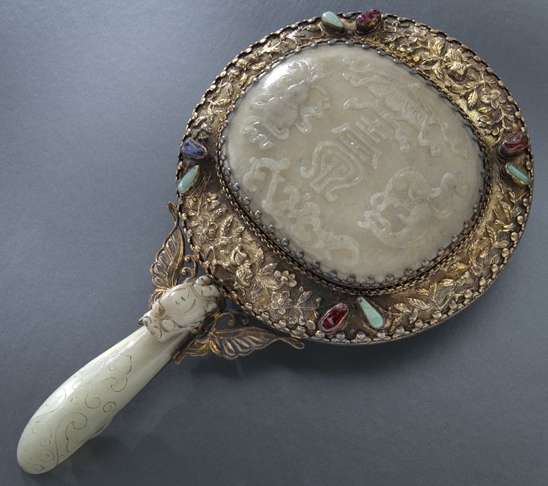 Chinese silver mounted jade mirrordepicting