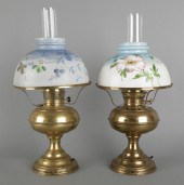 Two brass Rayo lamps with obverse painted
